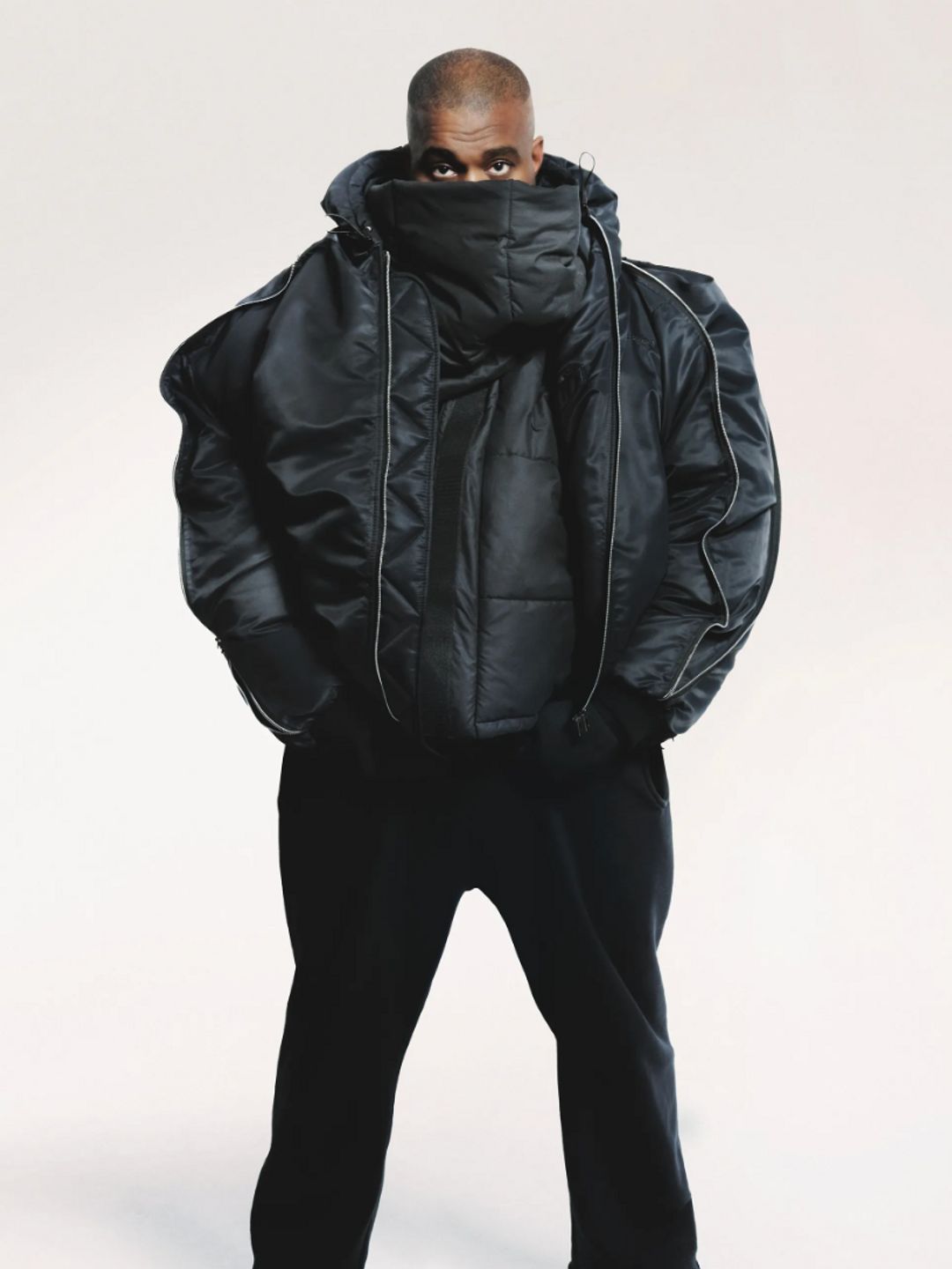 Ye ( Kanye West) wears an oversized black jacket in look 27 of the Y/Projectlookbook