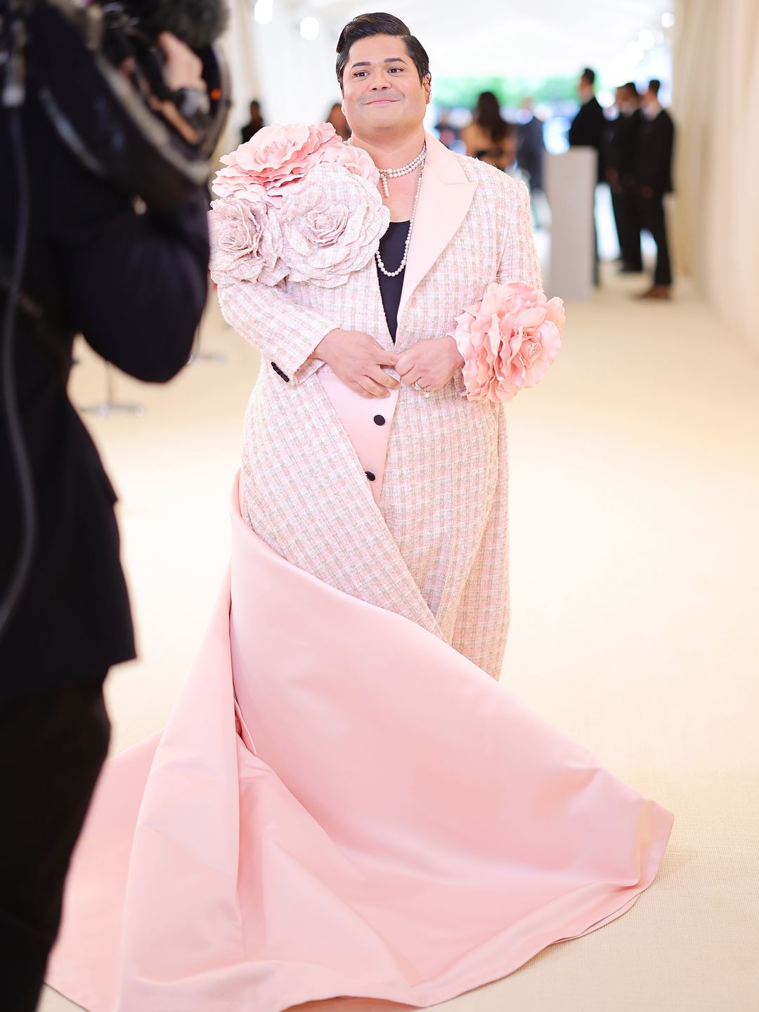The actor attending the 2023 Met Gala in a long pink light gown