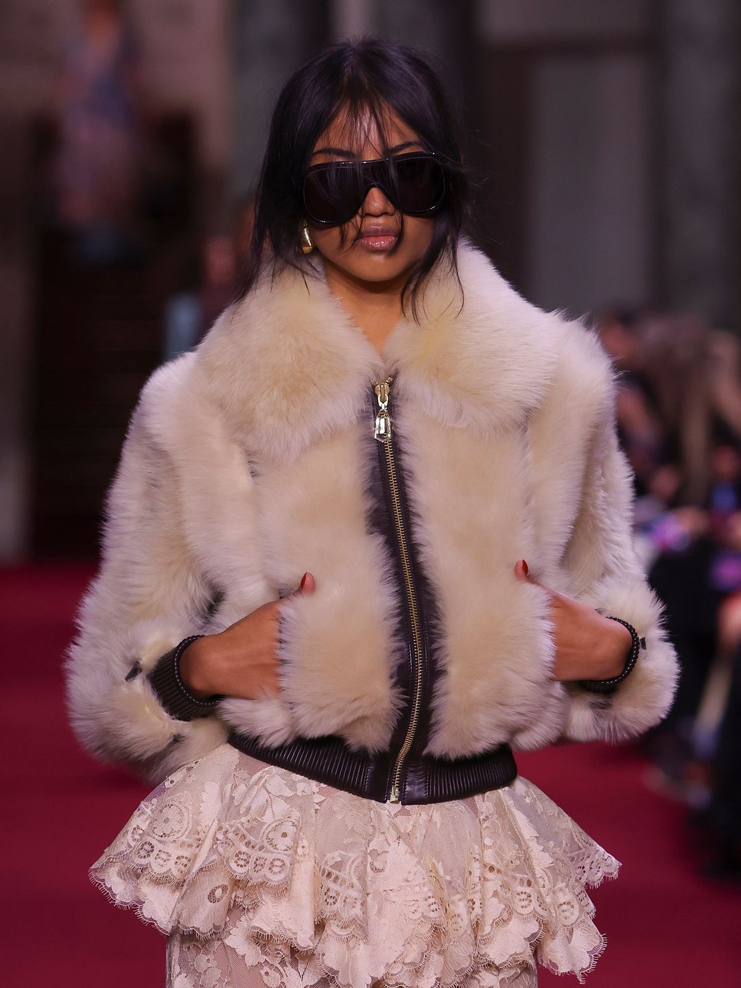 A model walks the runway during the Zimmermann Ready to Wear Fall/Winter 2024-2025 fashion show in a faux fur jacket