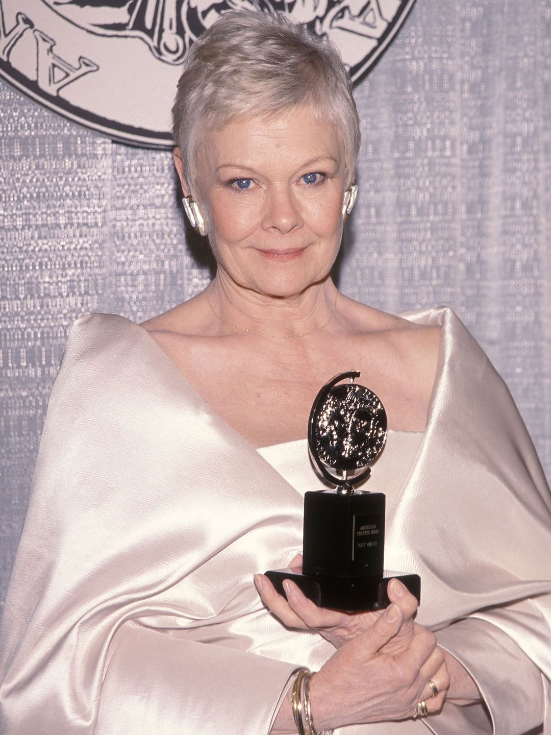 dame judi dench in white silk outfit