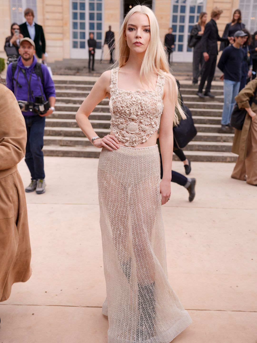 Anya Taylor-Joy wears a matching crochet look at the Christian Dior RTW Spring 2025 as part of Paris Ready to Wear Fashion Week