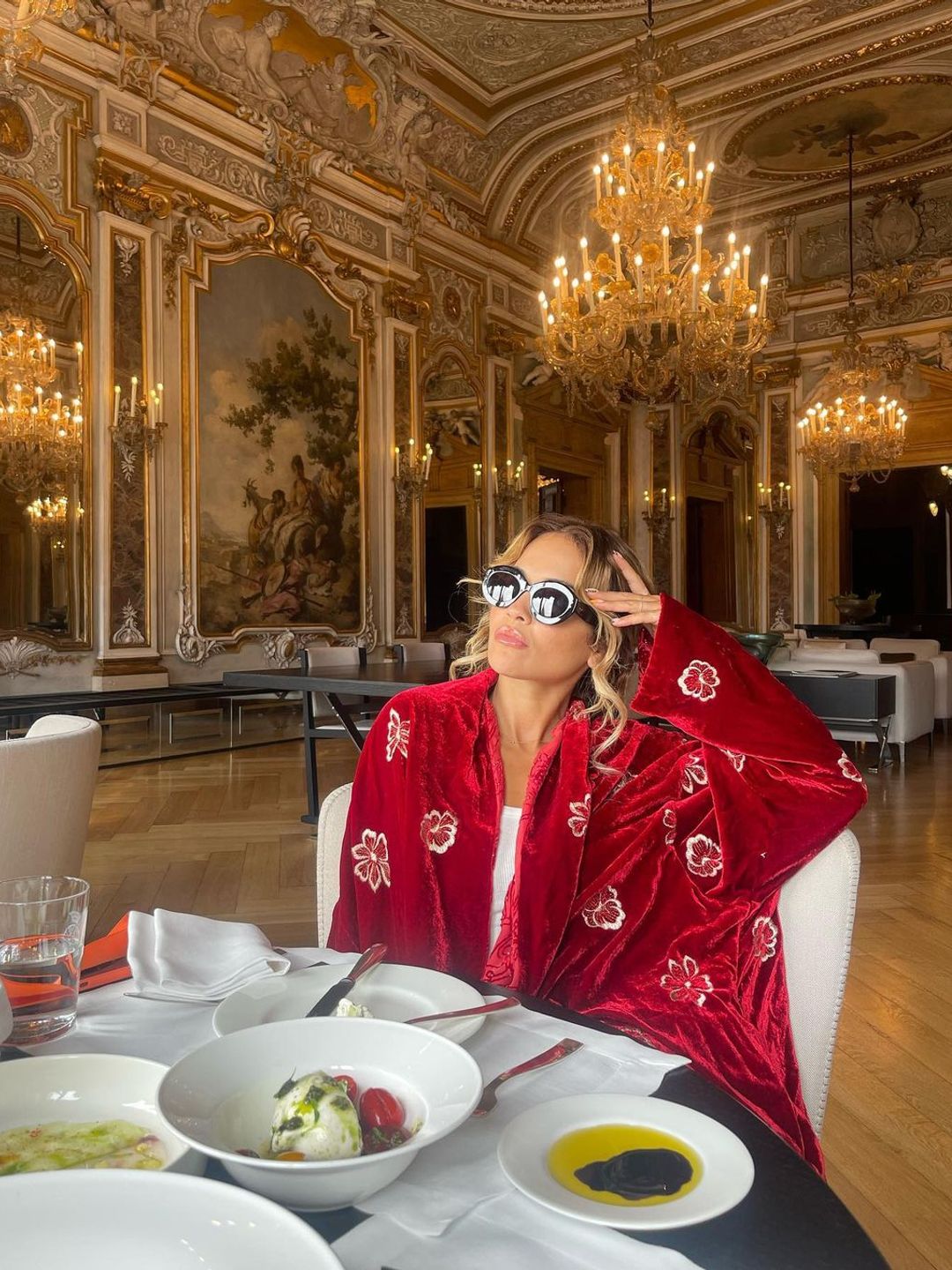 Rita Ora wearing a sumptuous red robe 
