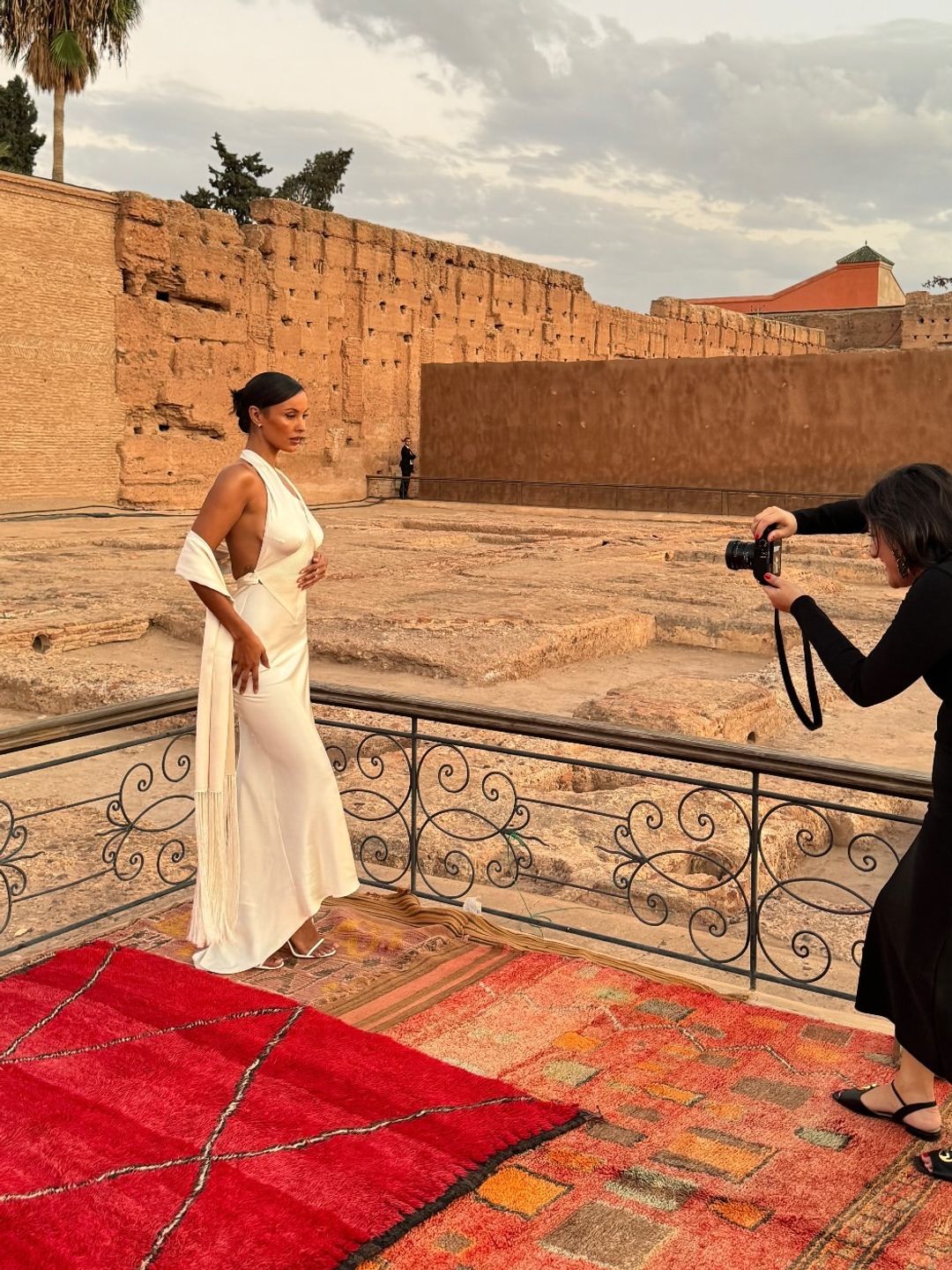 Maya Jama poses for a photo in a white slip dress 