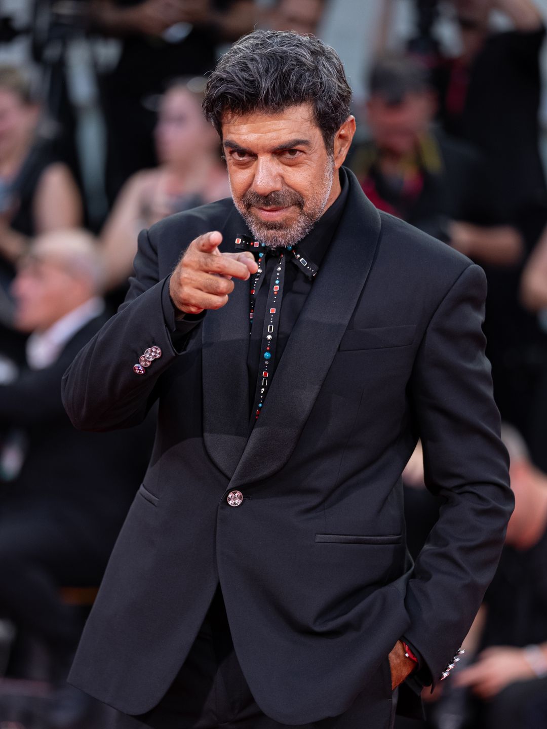 Pierfrancesco Favino in a black suit