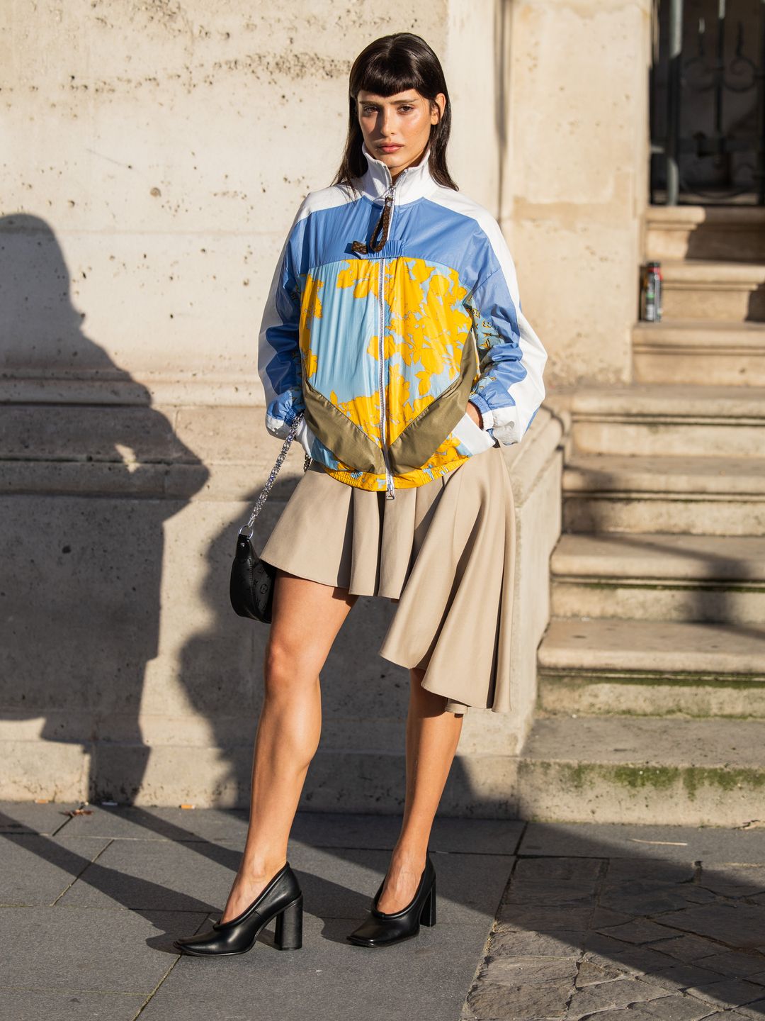 model in pleated skirt