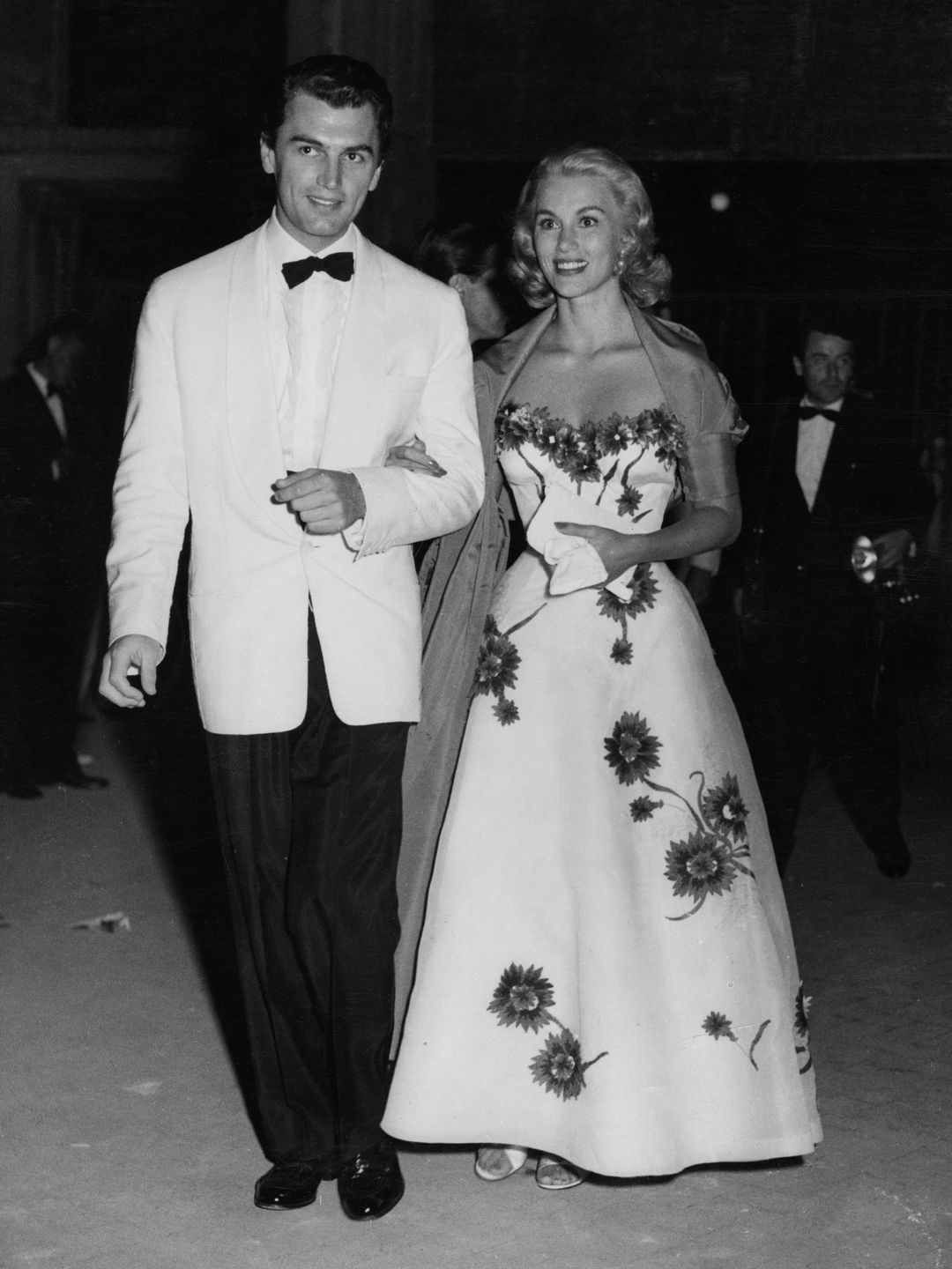 Actress Linda Christian in a white floral motif gown 