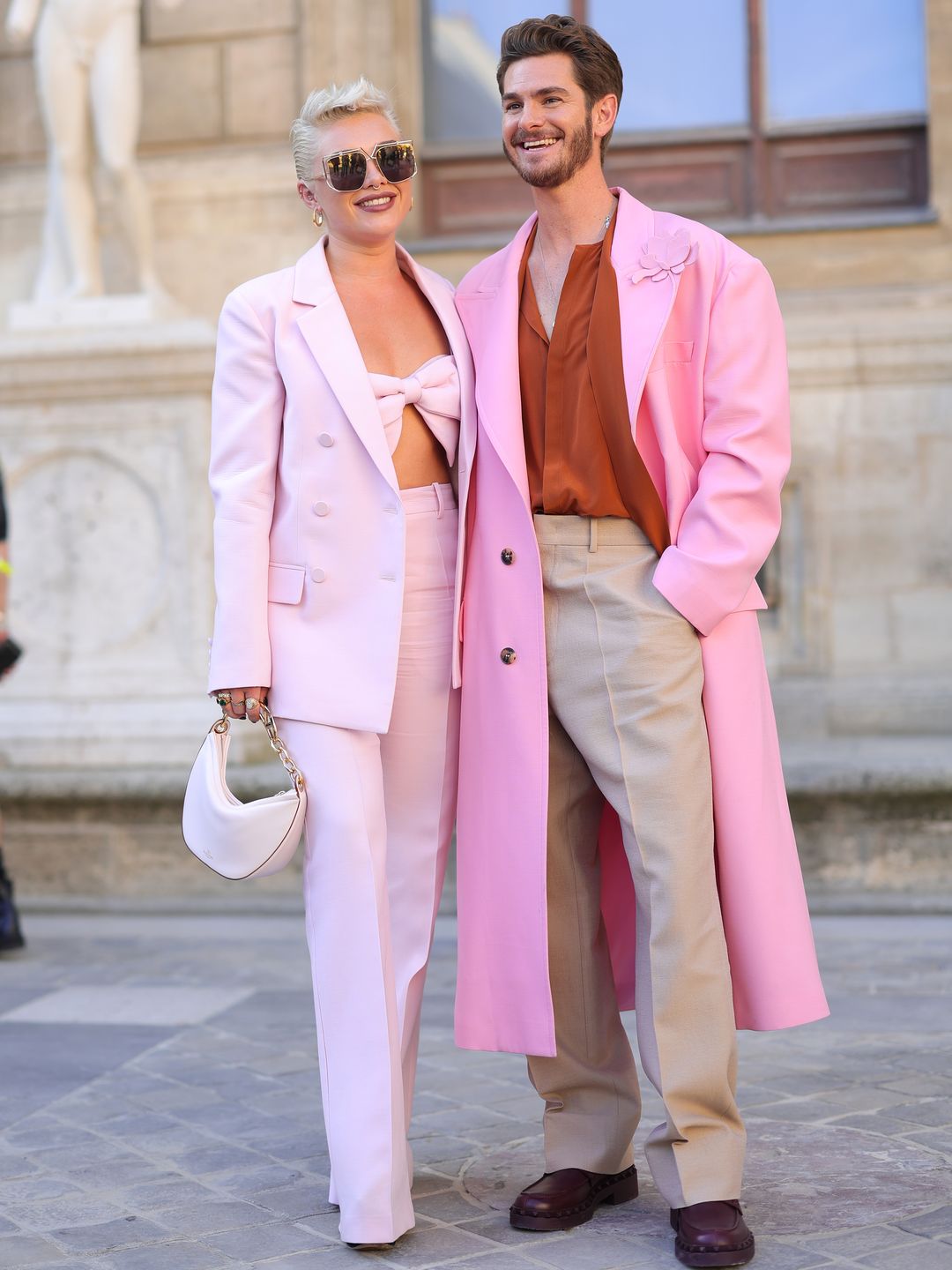 Florence Pugh and Andrew Garfield wearing pink outside Valentino