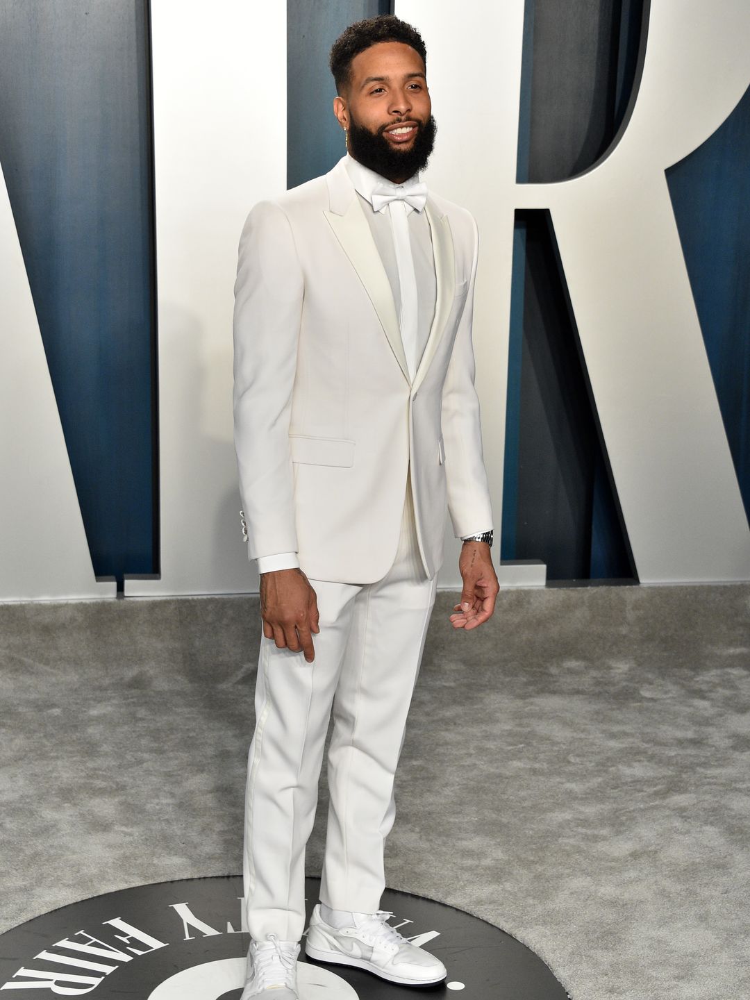 dell Beckham Jr. attends the 2020 Vanity Fair Oscar Party in an all-white tuxedo