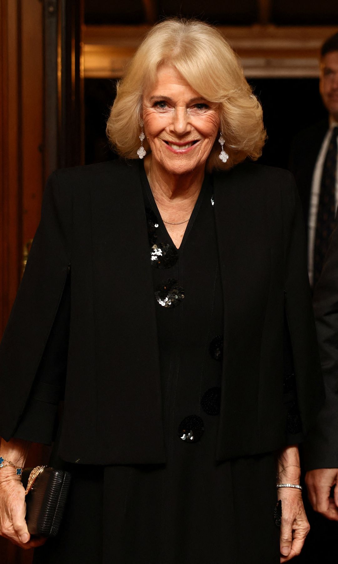 Queen Camilla wearing a black dress