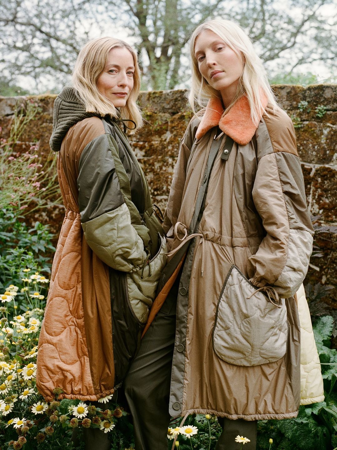 Ella Richards and Lucie de la Falaise wearing green coats 