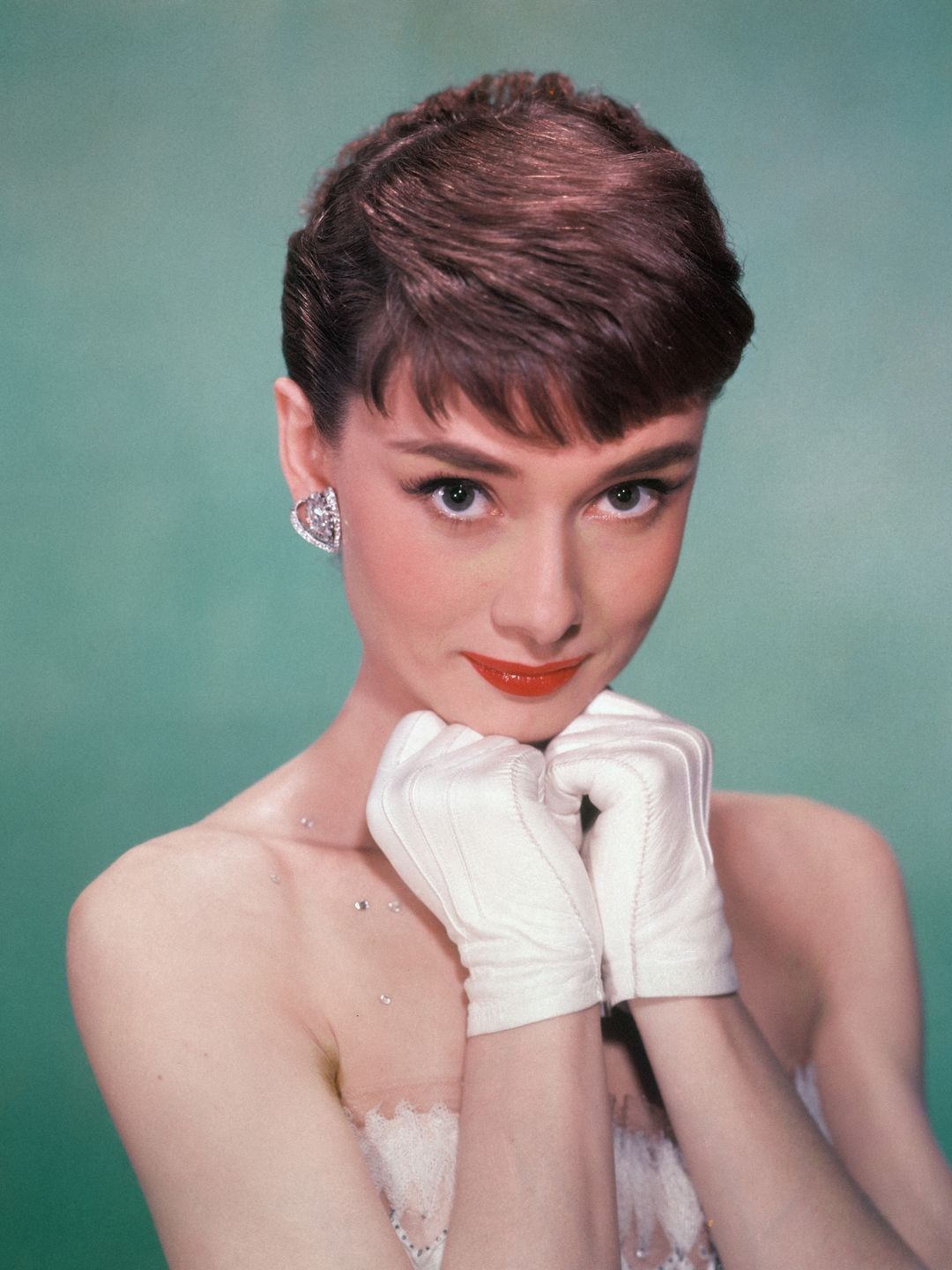 Audrey Hepburn wearing short white gloves 
