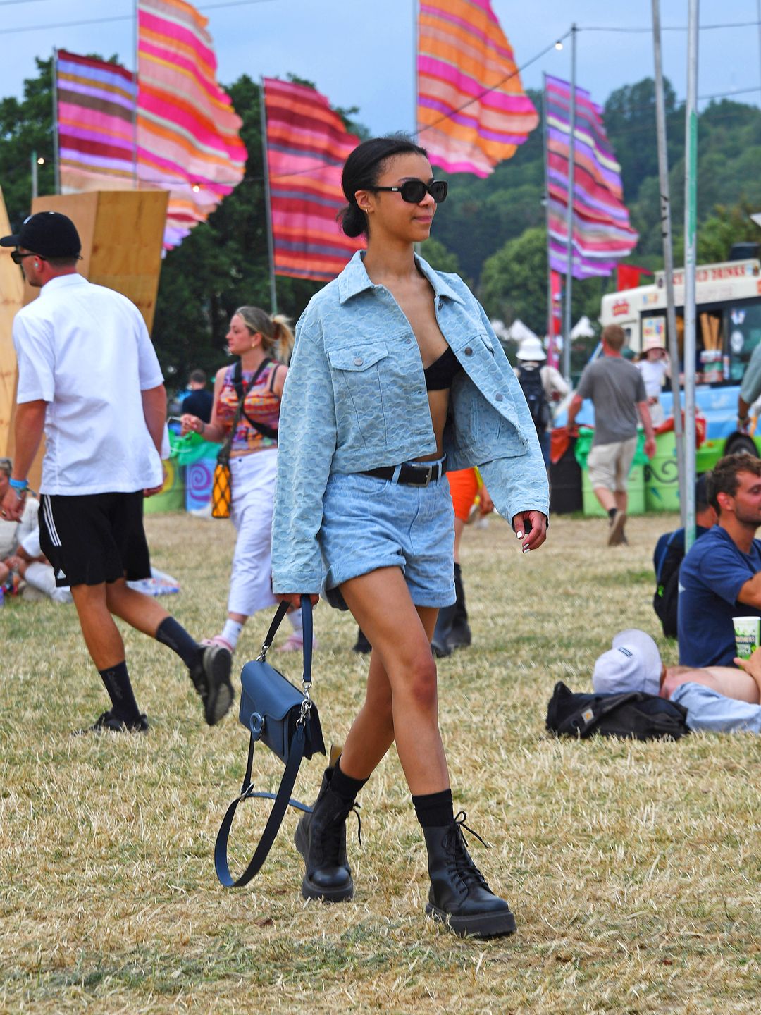 Queen Charlotte's India Ria Amarteifio attended day three of Glastonbury wearing double denim with a black bralet. 