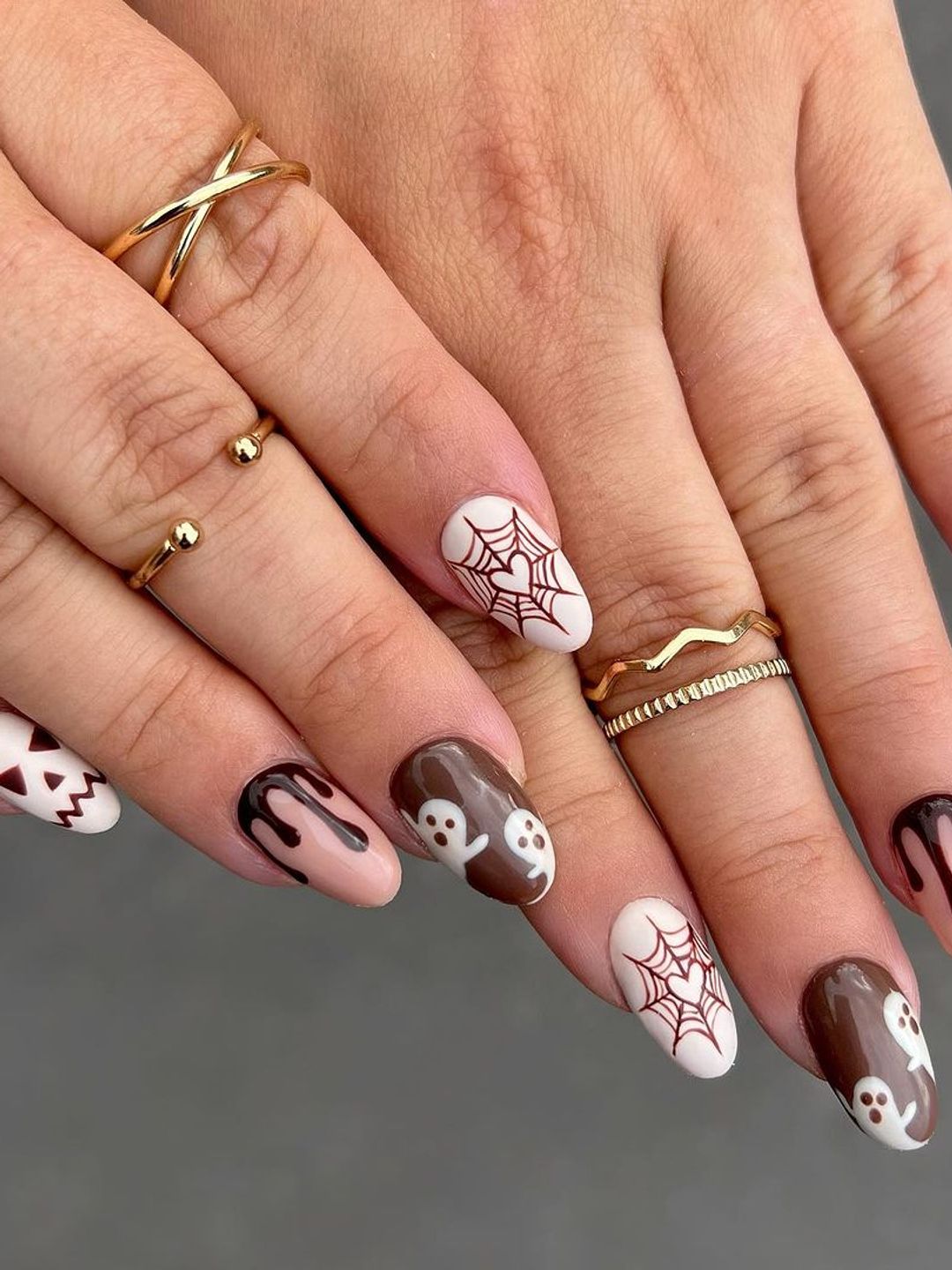 Brown Halloween nails with webs and ghosts 