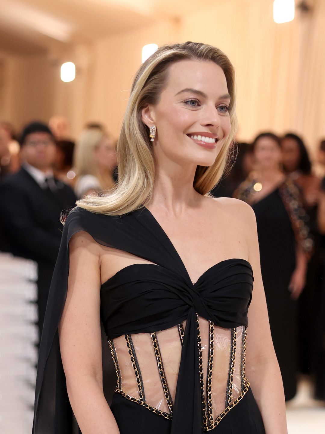 Margot Robbie with her hair down and flawless skin at the 2023 Met Gala 
