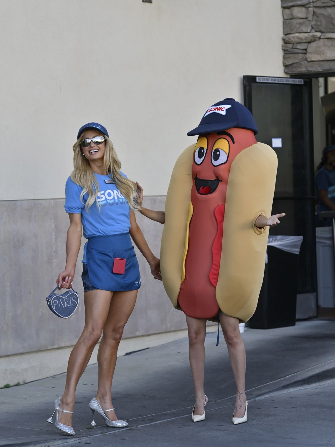 Paris Hilton and Nicole Richie work at Sonic Drive-In while filming scenes for their new show