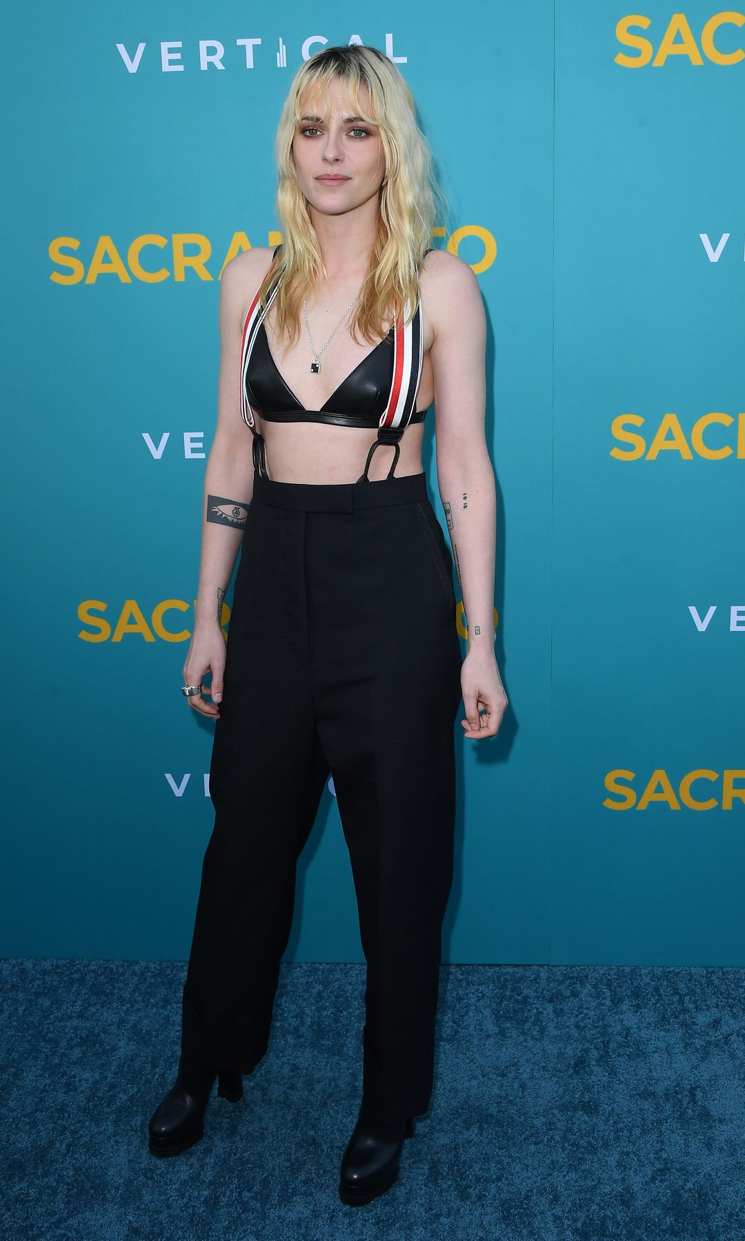 Kristen Stewart arrives at the Vertical Presents Los Angeles Special Screening Of "Sacramento"at Vista Theatre in black trousers and a leather bra