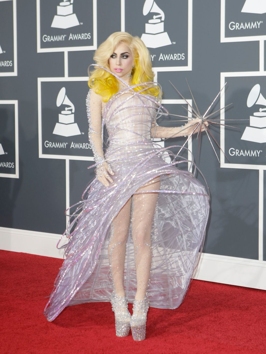 Lady Gaga wears a light up gown and yellow hair on the 2010 Grammy Awards red carpet