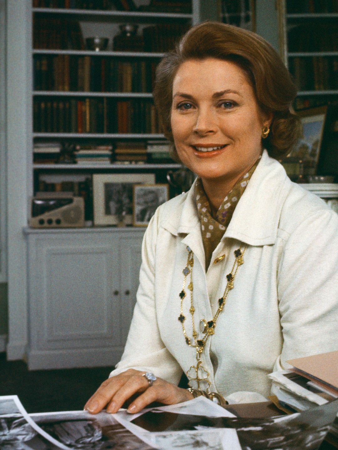 Princess Grace Kelly at her office in the Prince's Palace in Monte Carlo, Monaco wearing her Alhambra necklaces