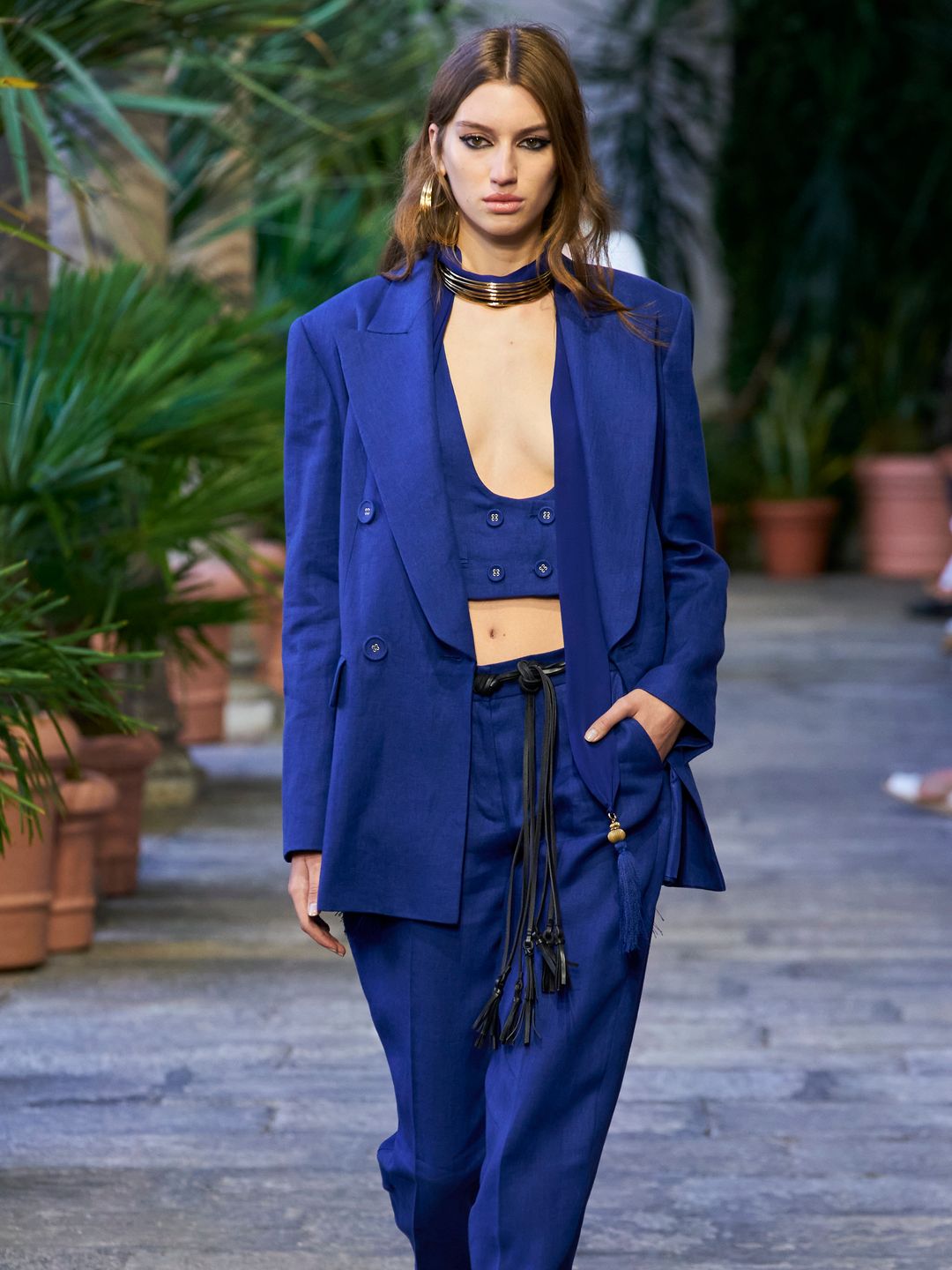 Luisa Spagnoli SS24 model wearing electric blue plunging waistcoat with matching blazer and trousers 