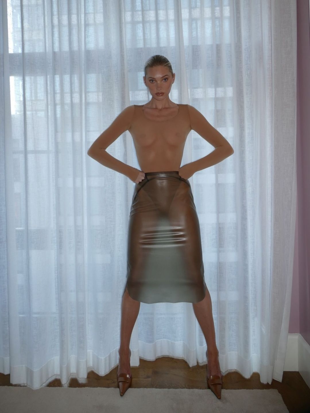 Elsa Hosk poses in a nude latex long-sleeve body suit and skirt on her Instagram