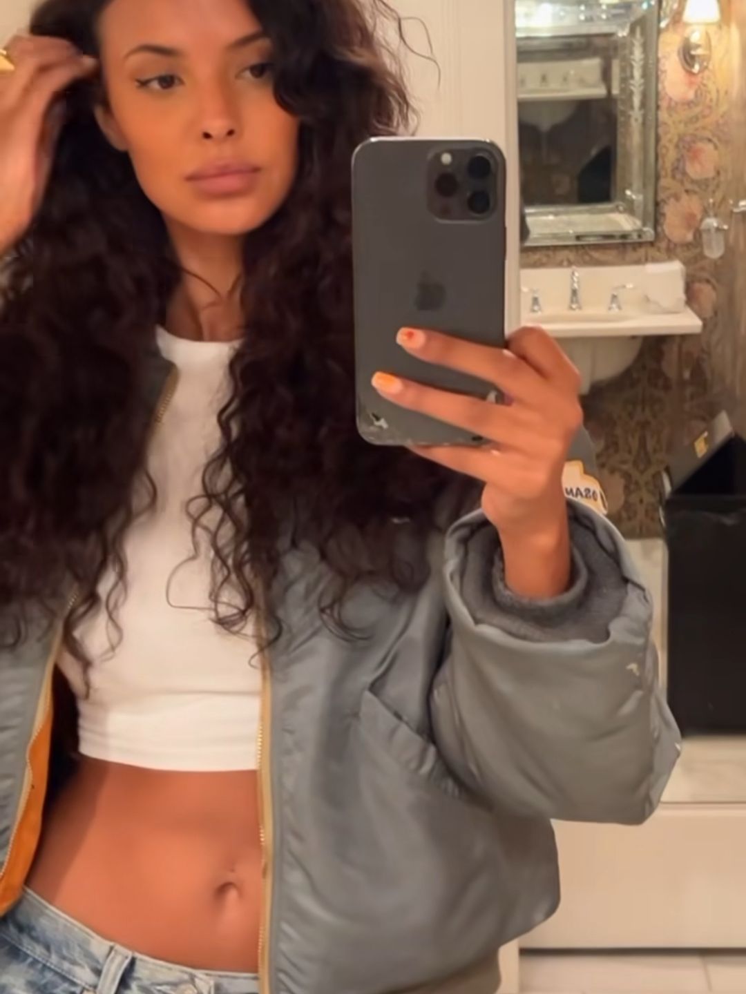 Maya taking mirror selfie in LA