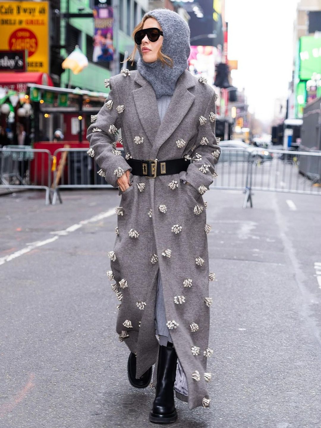 Rita Ora wears a grey hood and matching coat in NYC