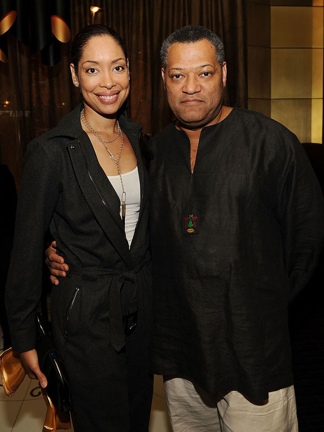 Gina Torres and Laurence Fishburne attend the reception for the world premiere of Cirque du Soleil's "Viva ELVIS" at Aria in CityCenter on February 19, 2010