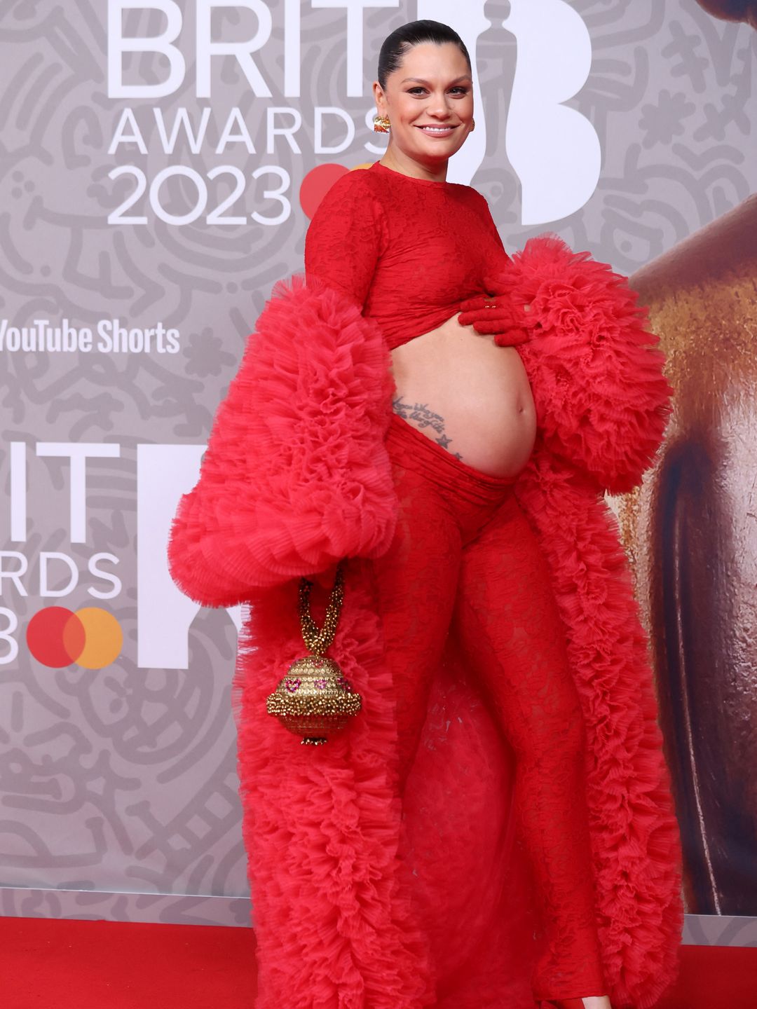 Jessie J poses on the red carpet in an all-red outfit