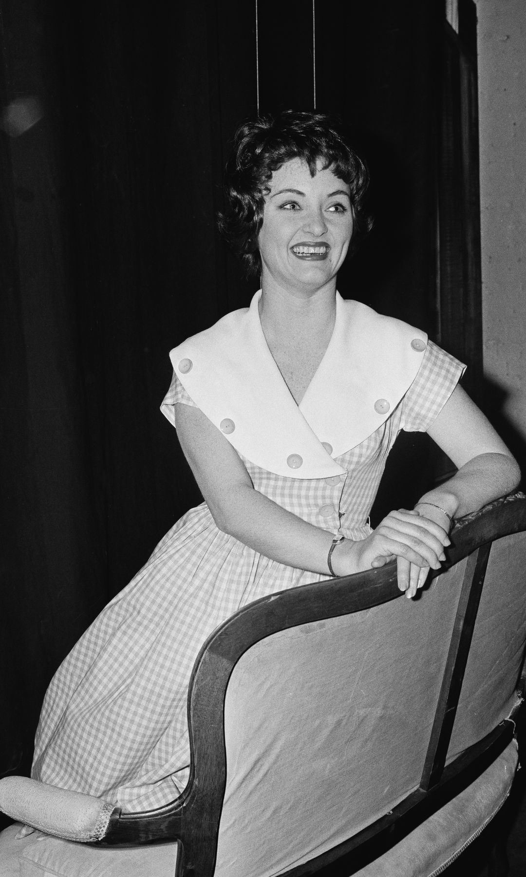 Black-and-white photo of Anna Dawson backstage at an event