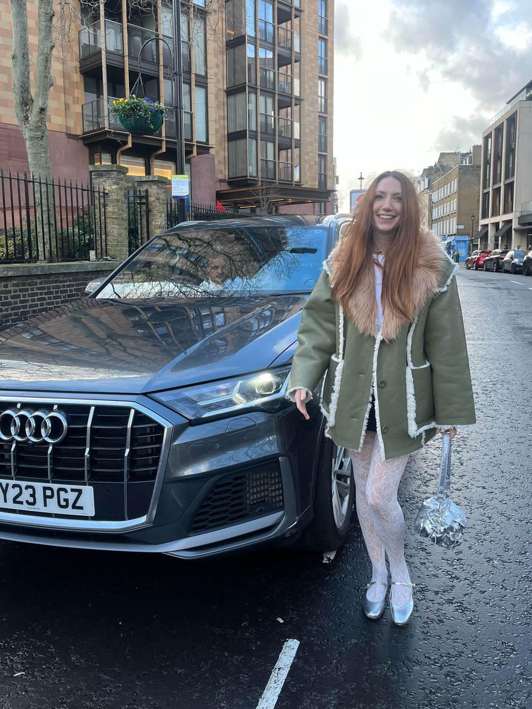 Clare Clare Pennington spotted at London Fashion Week next to and Audi Q7 car
