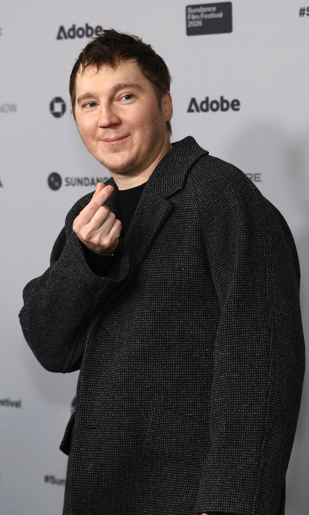 Paul Dano in a black outfit