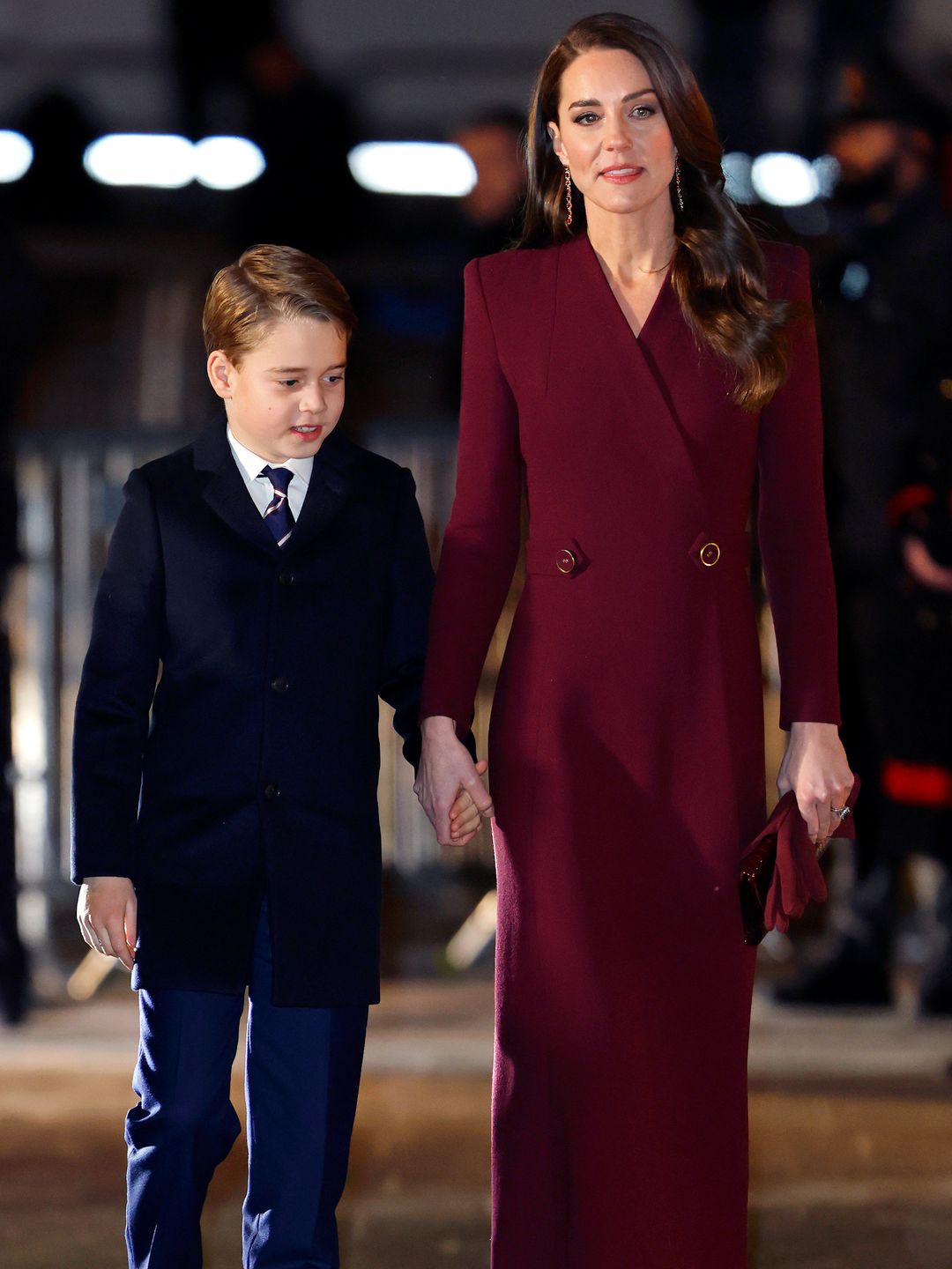 Princess Kate in a burgundy coat with Prince George at The 'Together at Christmas' Carol Service at Westminster Abbey in 2022