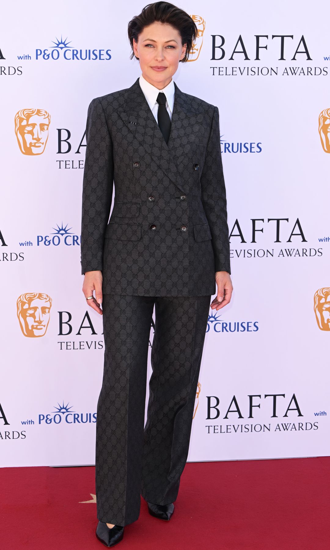 Emma Willis in a plaid suit on the red carpet