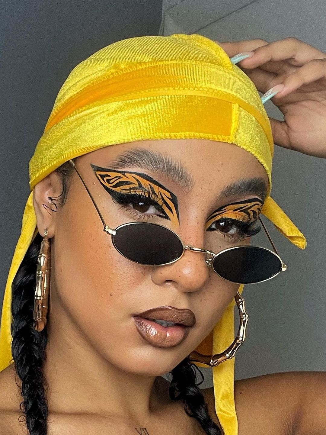 Woman with tiger print design eyelids 