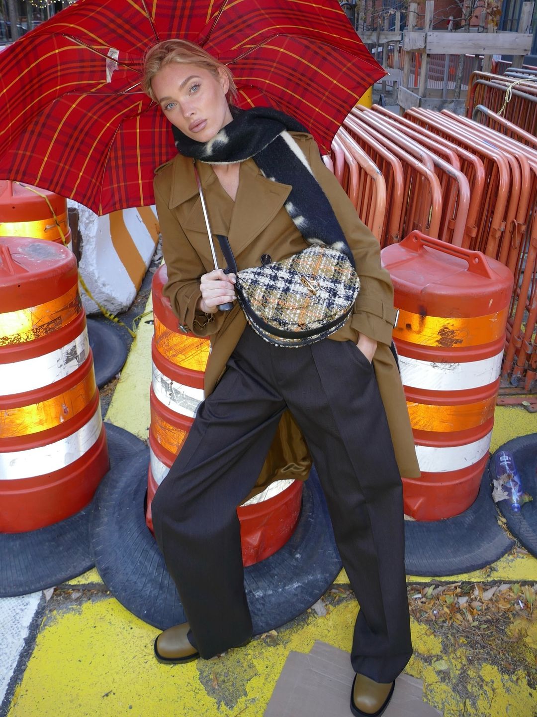 Elsa Hosk wears a Burberry trench, bag, boots and trouser look on her Instagram 