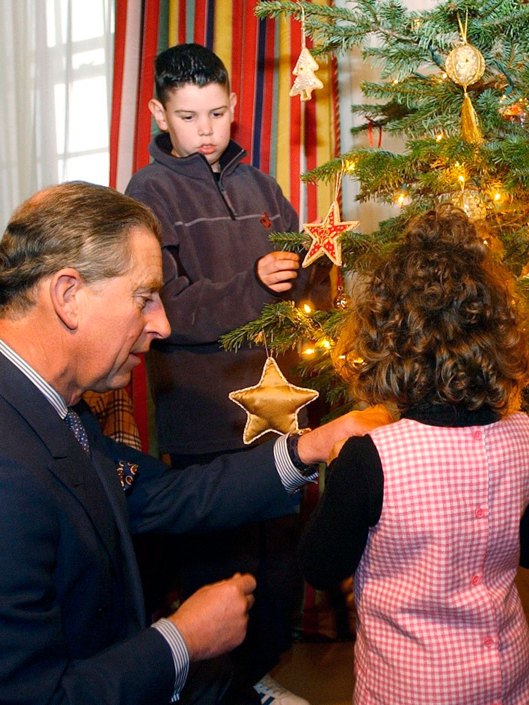 king charles decorating christmas tree