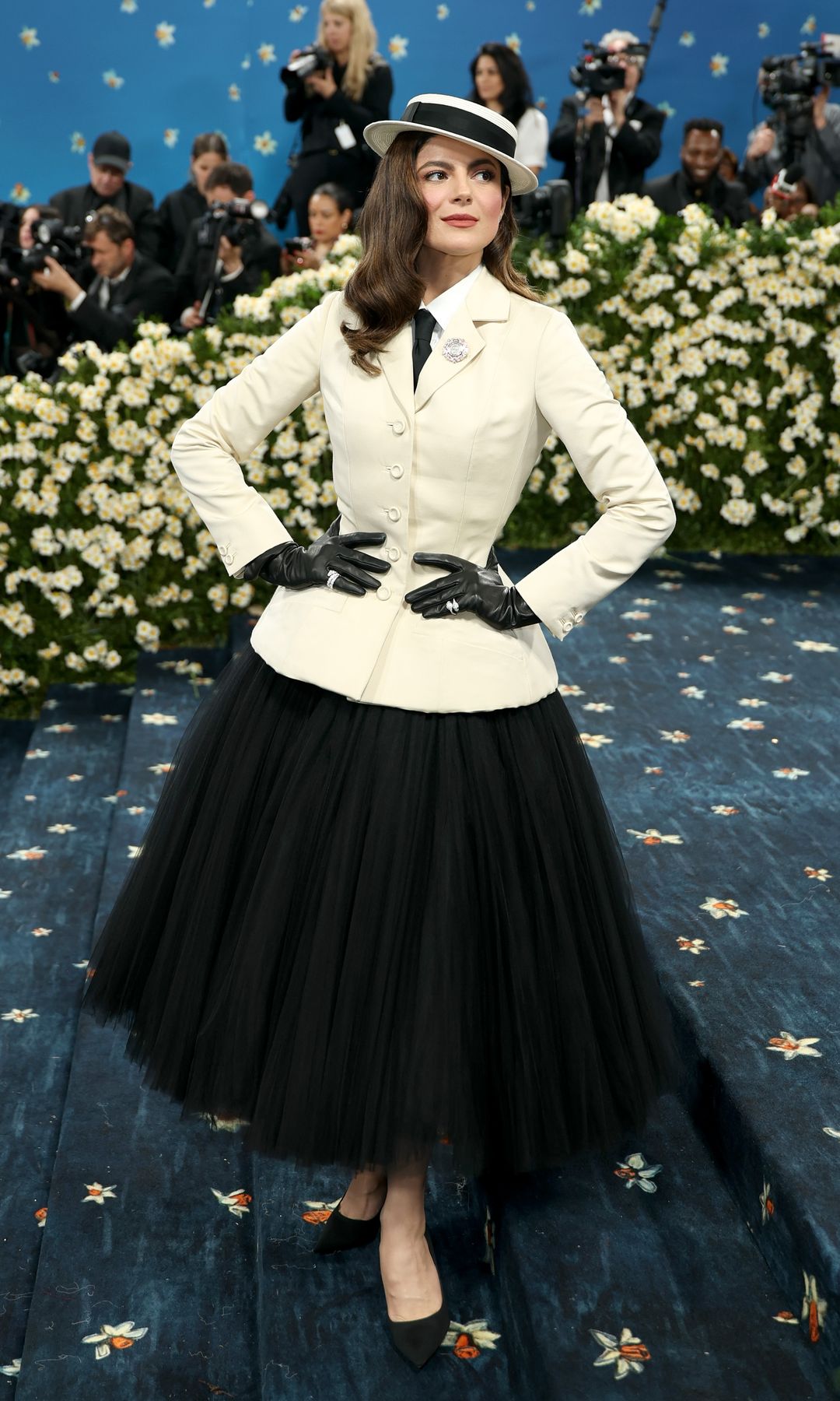 Monica Barbaro attends the 2025 Met Gala in Dior 'New Look' dress