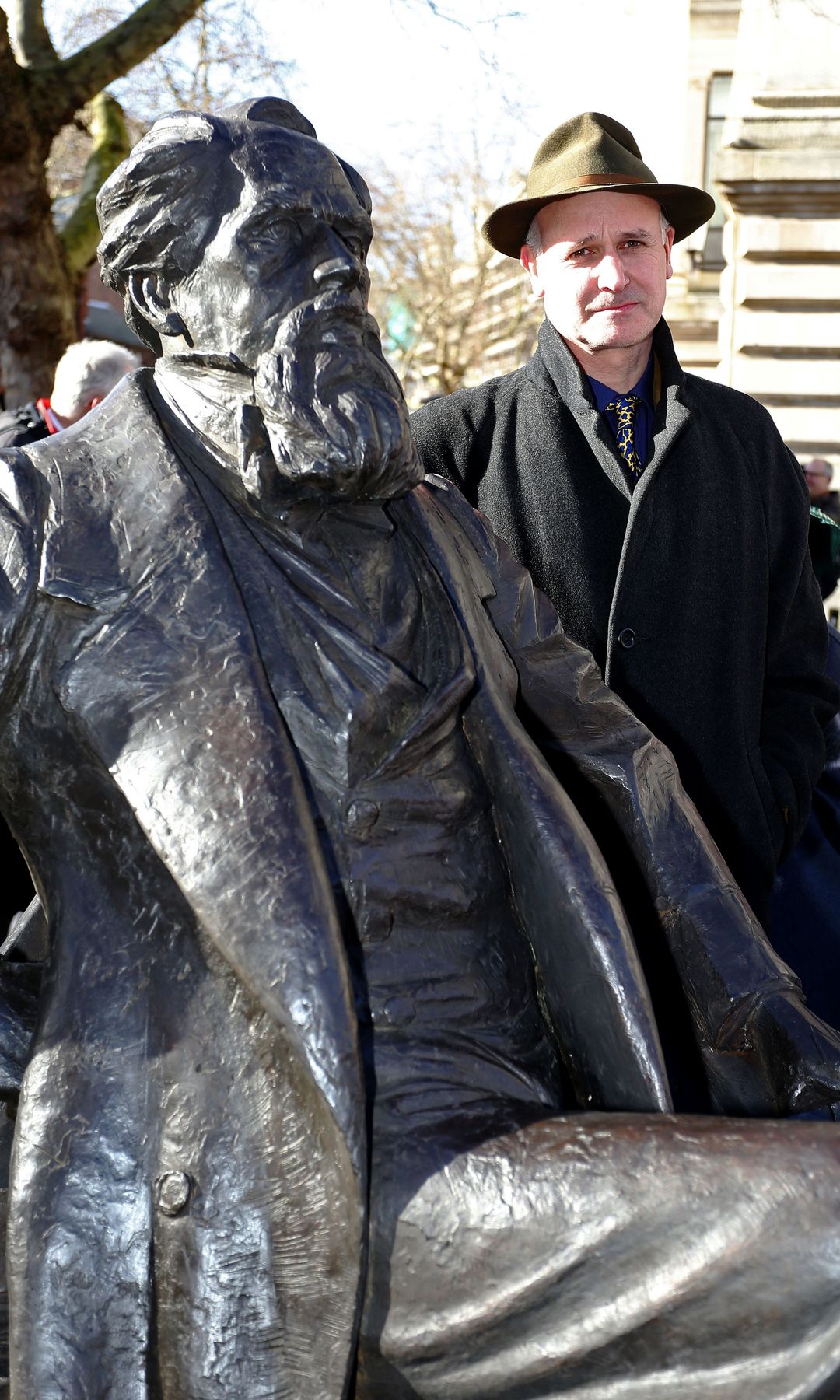 Martin Jennings with his statue of Charles Dickens