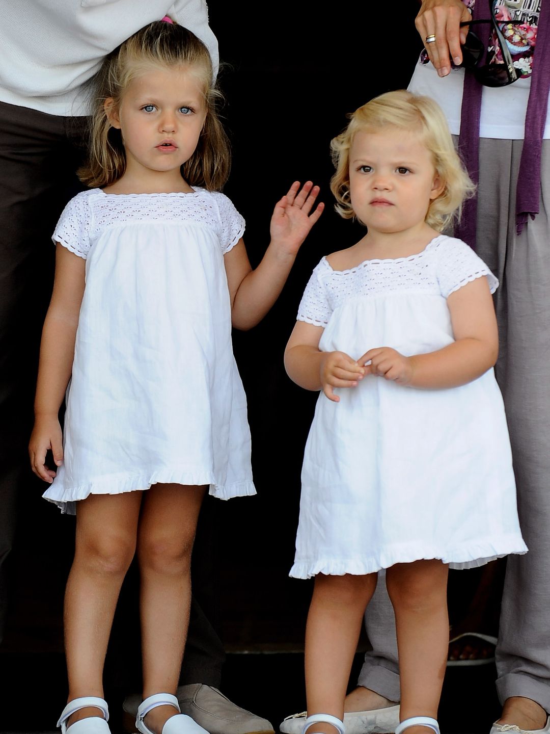 A young Princess Leonor and Infanta Sofia in young dresses