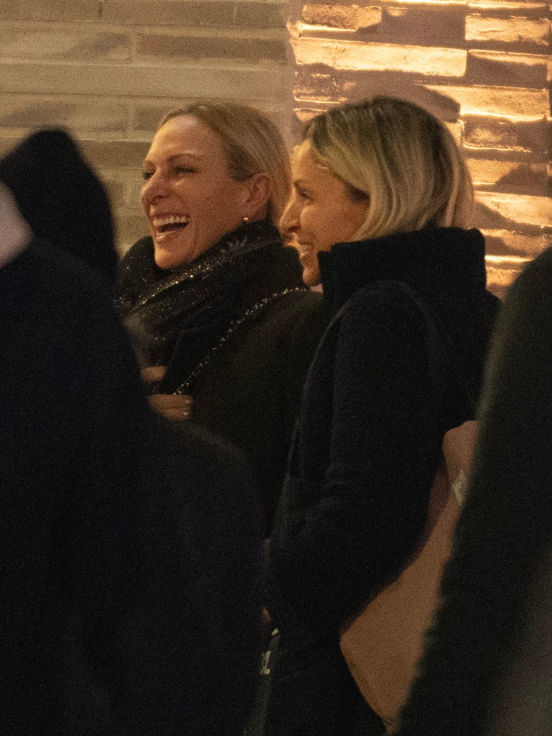 Zara Tindall laughing with a group of friends