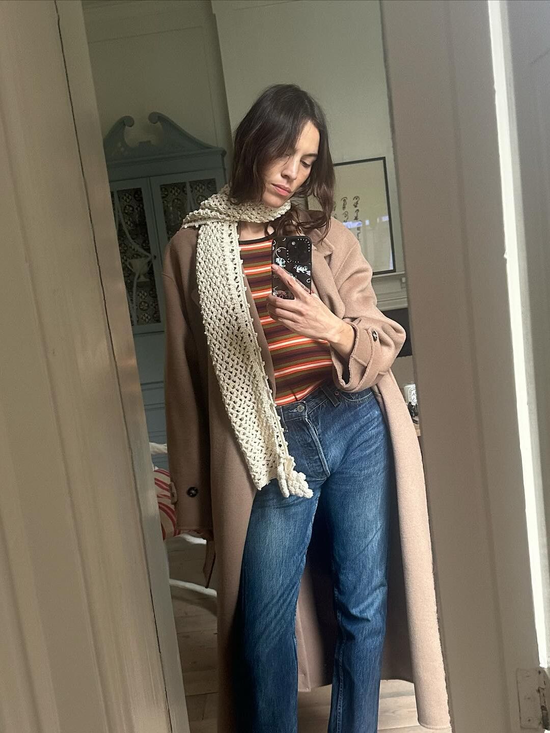 Alexa Chung shares a photo of herself in jeans and a striped jumper