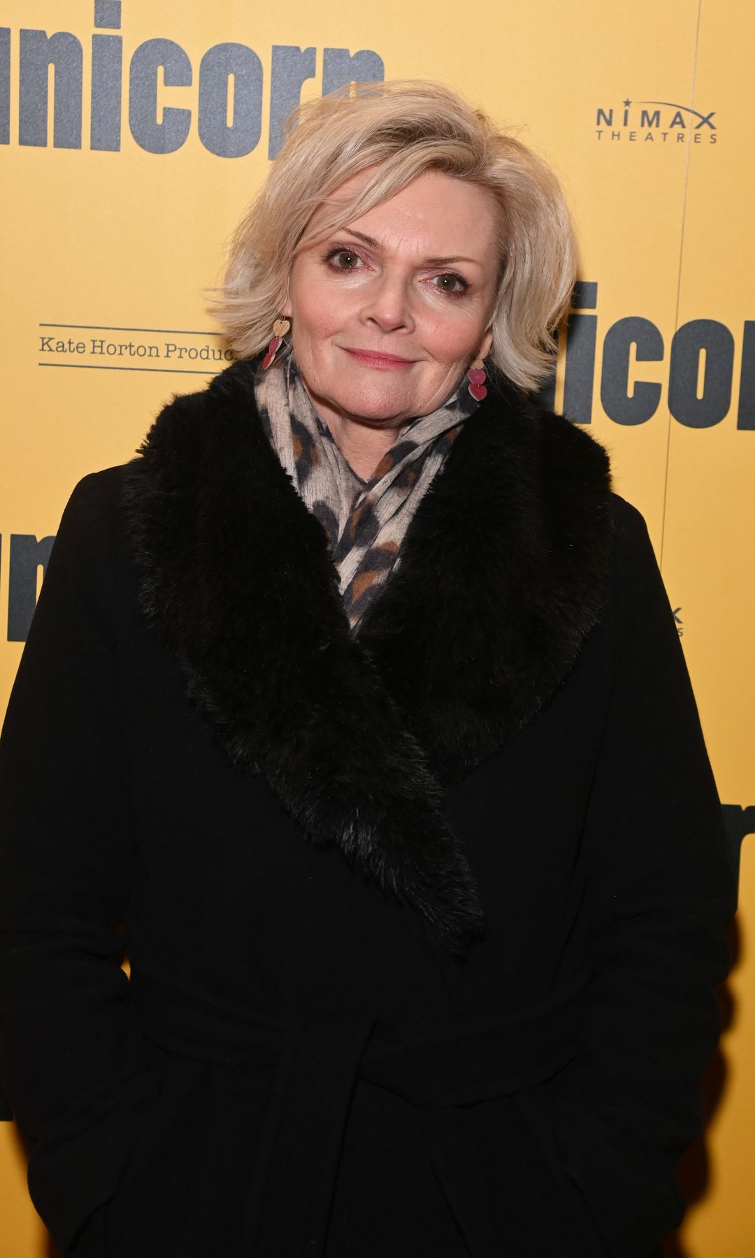 Sharon Small in a large black coat