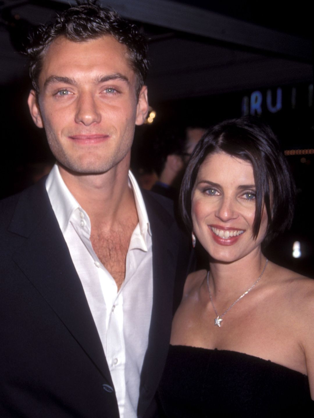 Jude and his first wife Sadie Frost smiling at the camera