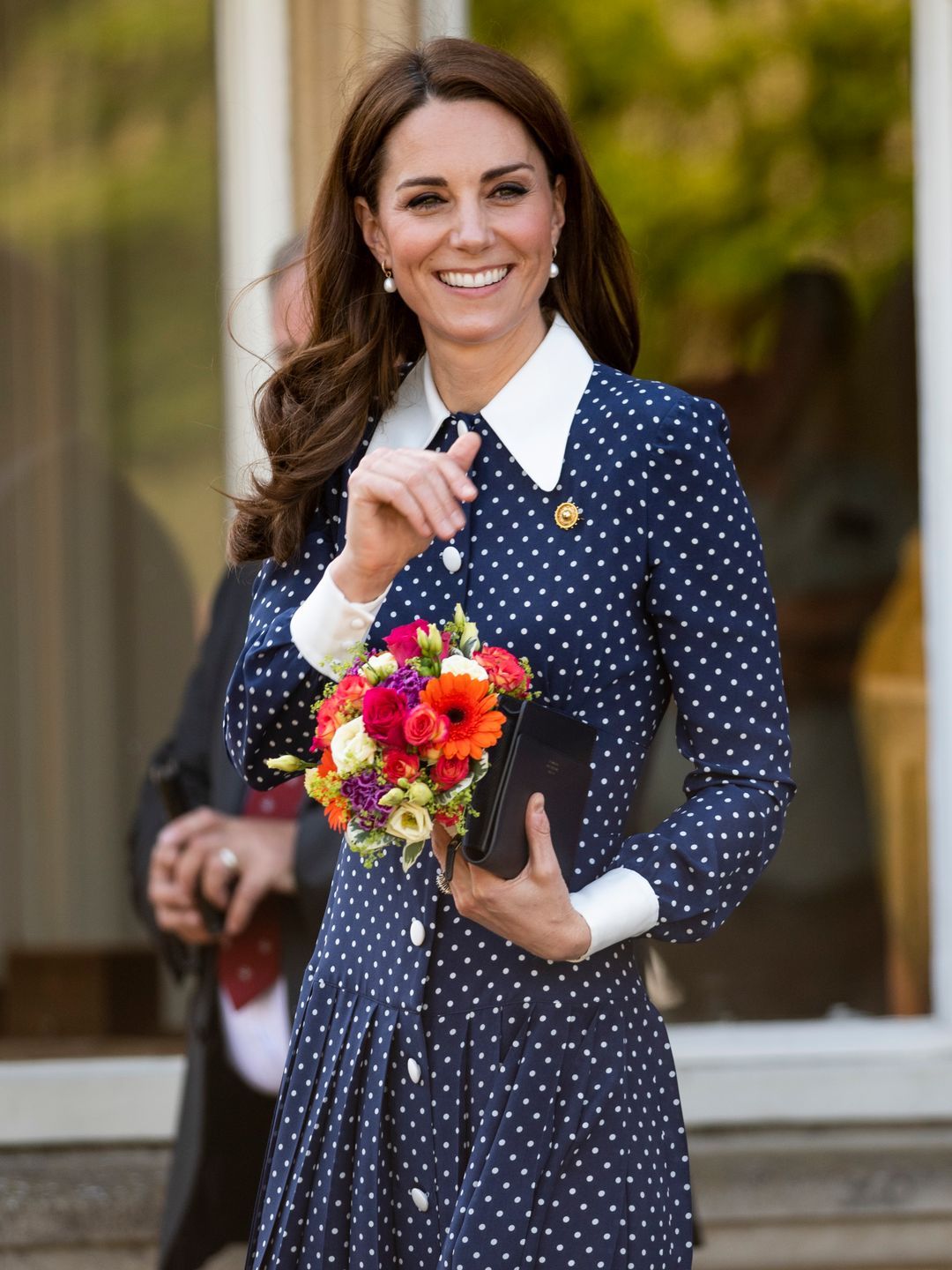 Princess Kate visits the D-Day exhibition at Bletchley Park on May 14, 2019 in Bletchley, England wearing an Alessandra Rich dress
