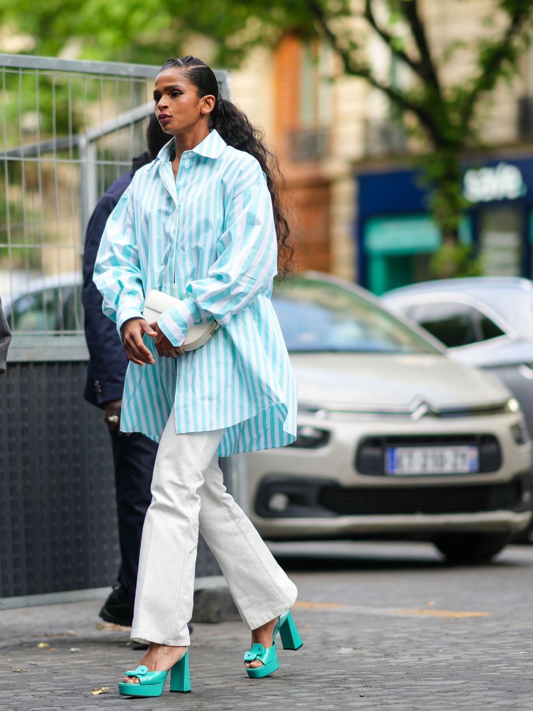 A guest donned a mint and white oversized shirt with cream trousers and statement platforms.