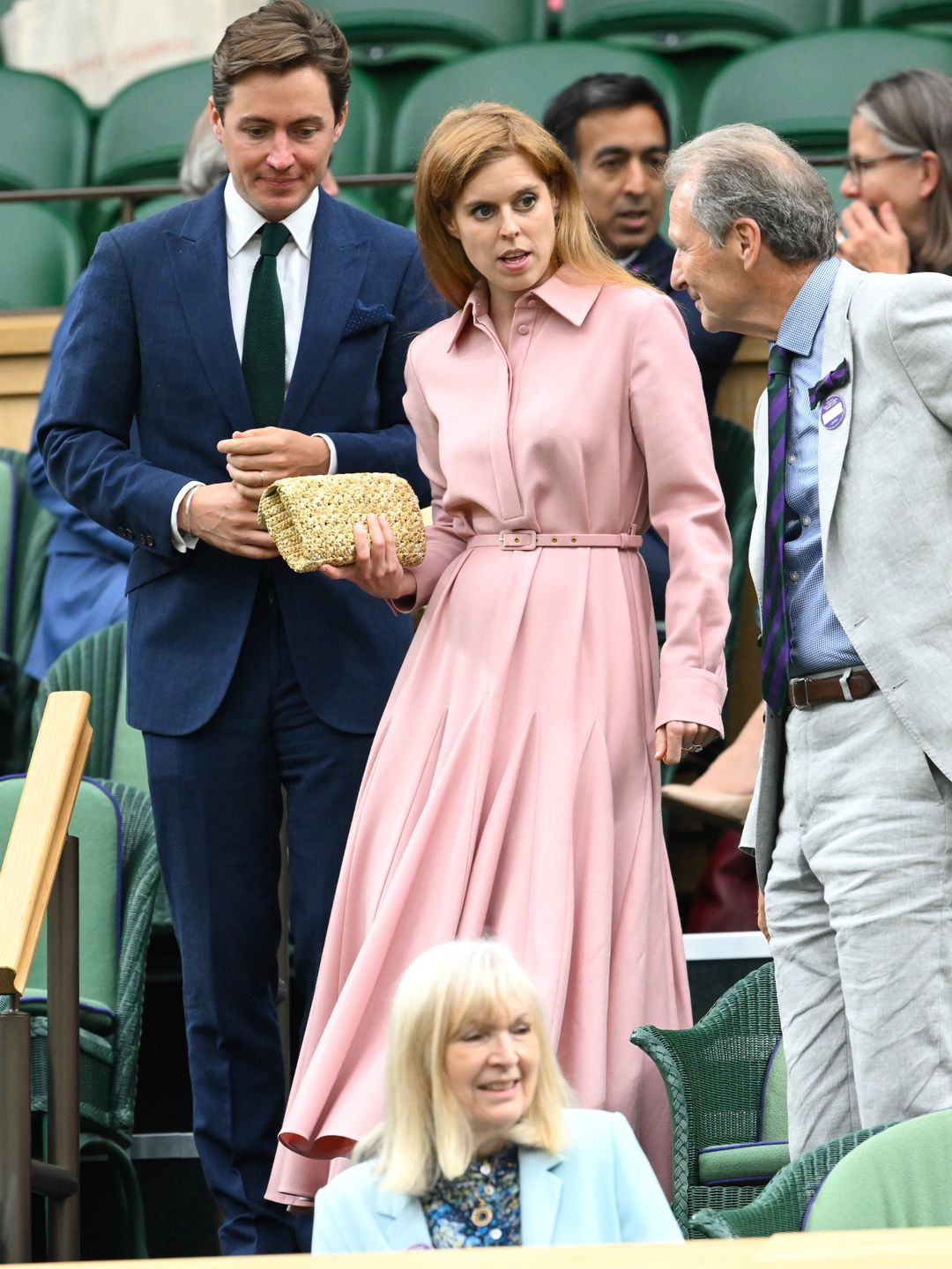 Princess Beatrice wore the Emilia Wickstead ‘Marione’ dress in pink and Roger Vivier's 'Broche Vivier Buckle Crochet Clutch' in raffia 