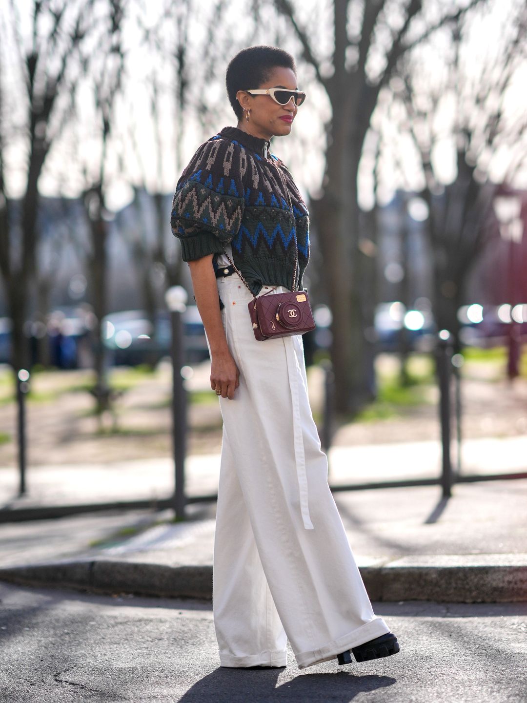 Tamu McPherson in white jeans, a chunky knit and glorious Chanel camera bag. 