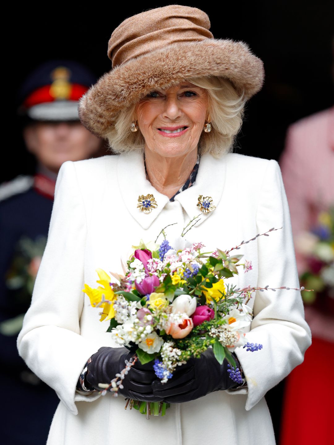 Queen Camilla carries a traditional Nosegay bouquet as she attends the Royal Maundy Service at Worcester Cathedral 