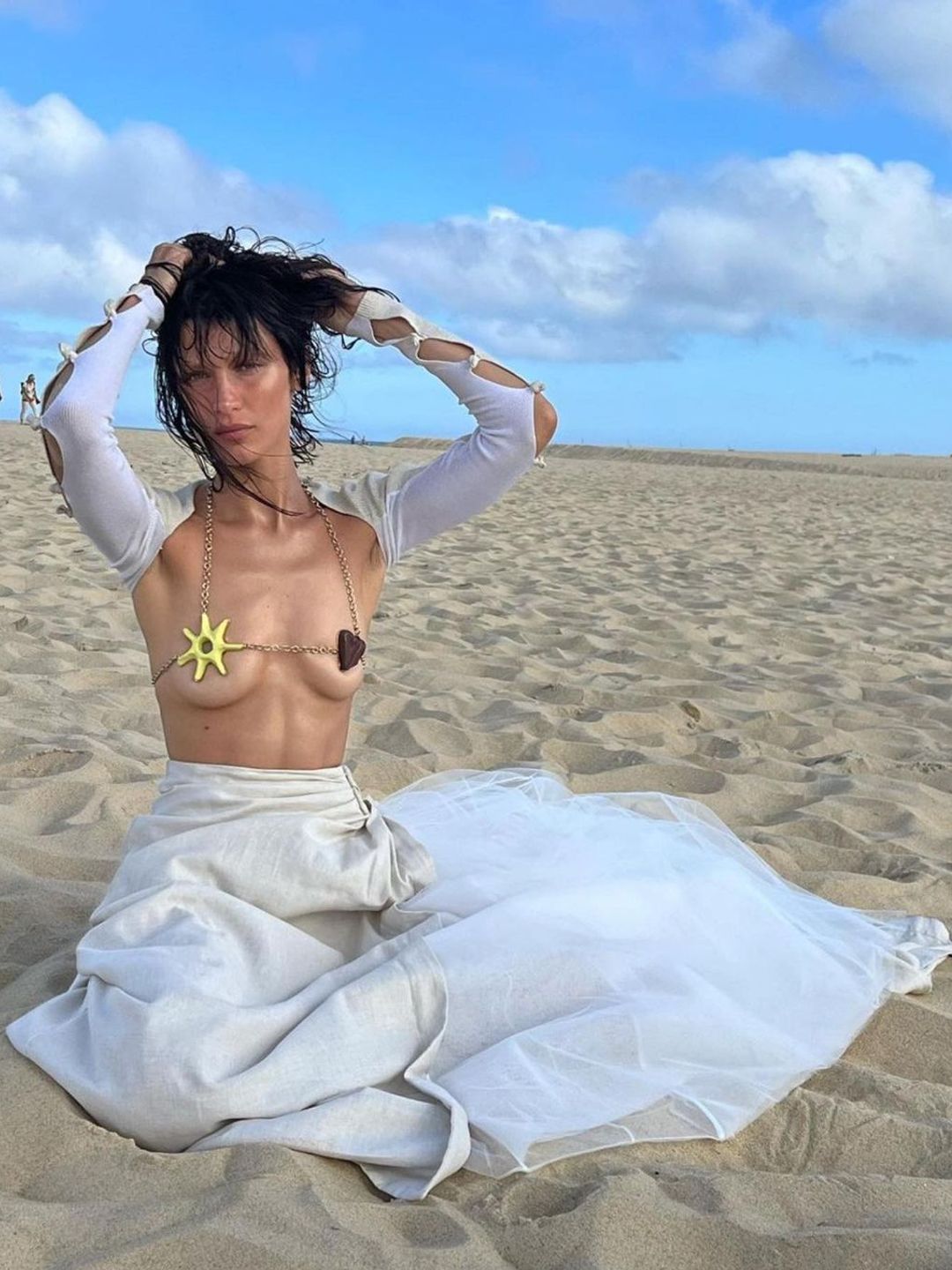 Bella Hadid poses for Jacquemus' summer collection in a bikini and maxi skirt