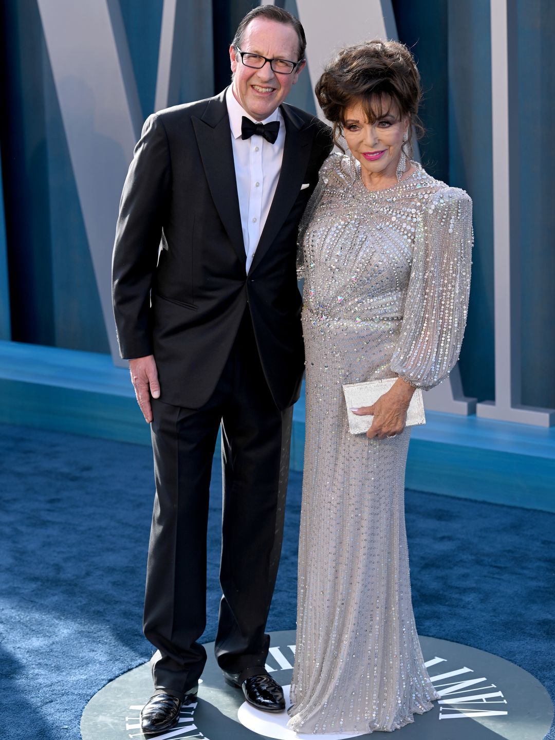 Joan with her husband Percy smiling at the Oscars in 2022